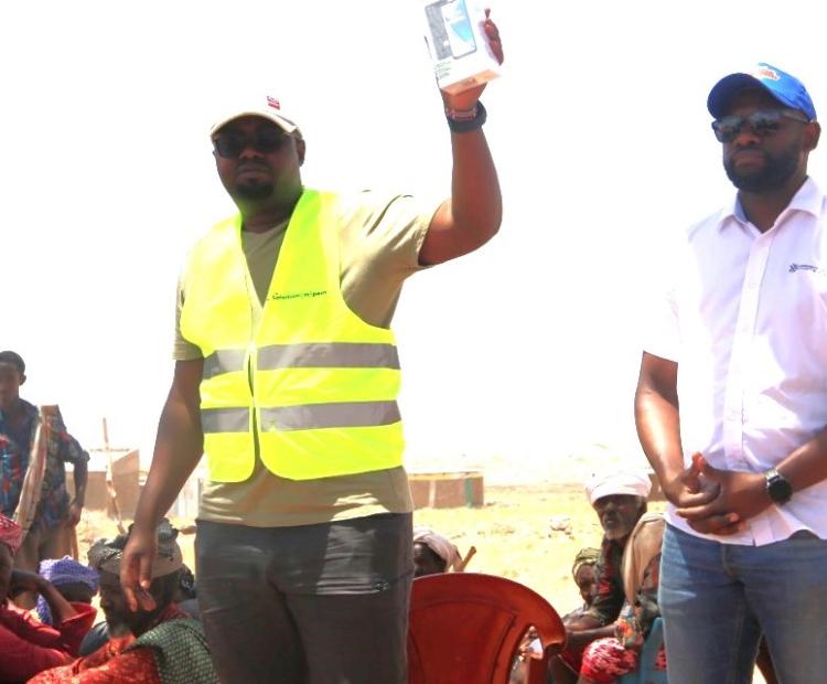 Safaricom PLC's Mr. Ian Siako and CA's Eng. Edwin Ombega during a digital skilling exercise in Marsabit County