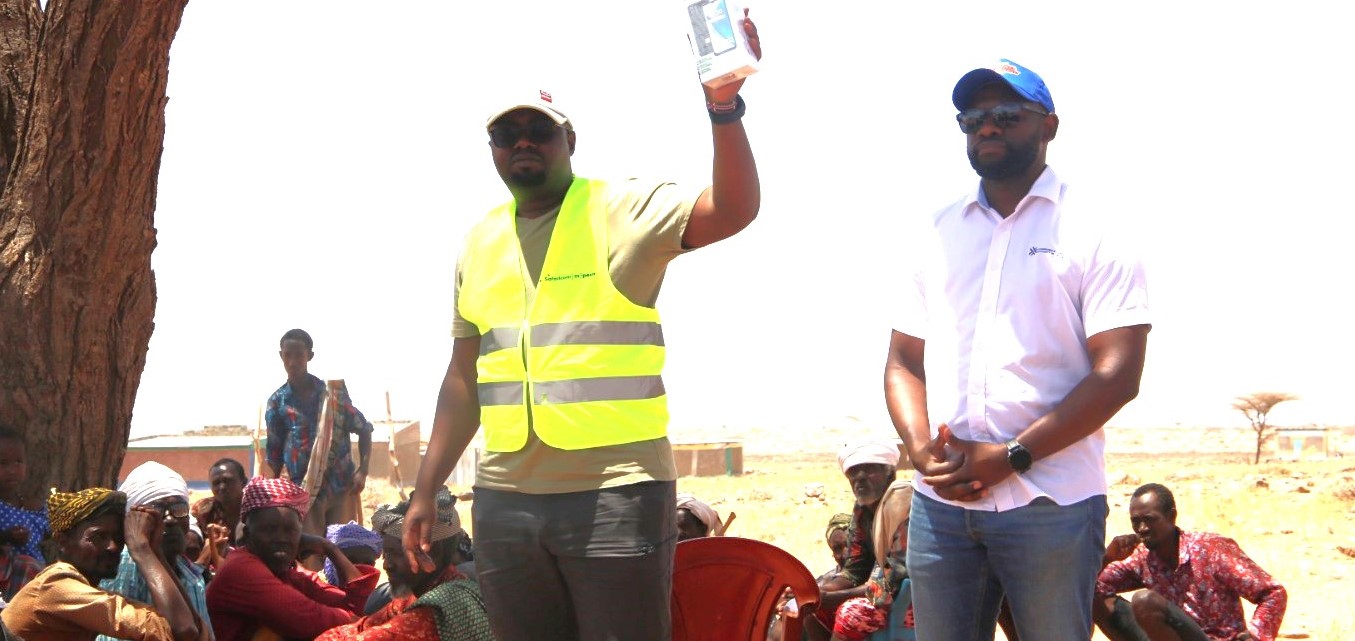 Safaricom PLC's Mr. Ian Siako and CA's Eng. Edwin Ombega during a digital skilling exercise in Marsabit County