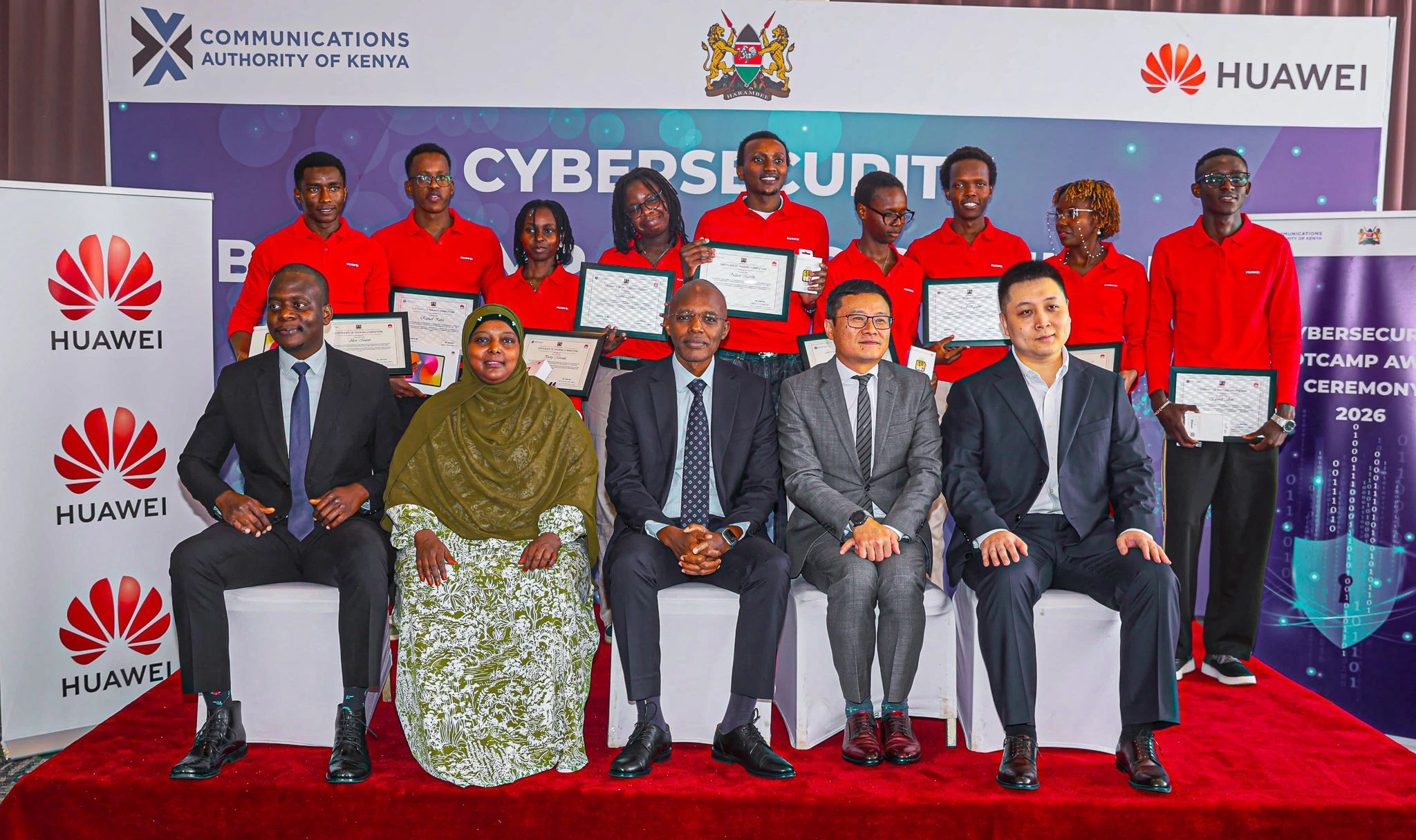 Eng. Dennis Chepkwony, Director, Universal Service Fund at the Communications Authority of Kenya poses for a group photo with reps from Huawei Kenya and winners of this year's cybersecurity bootcamp