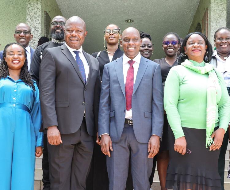 Prof. Edward Kisiang'ani, Principal Secretary, State Department for Broadcasting and Telecommunications (fourth left) and the CA Director General Mr. David Mugonyi (fourth right) with other participants during the Safer Internet Day event in Nairobi.