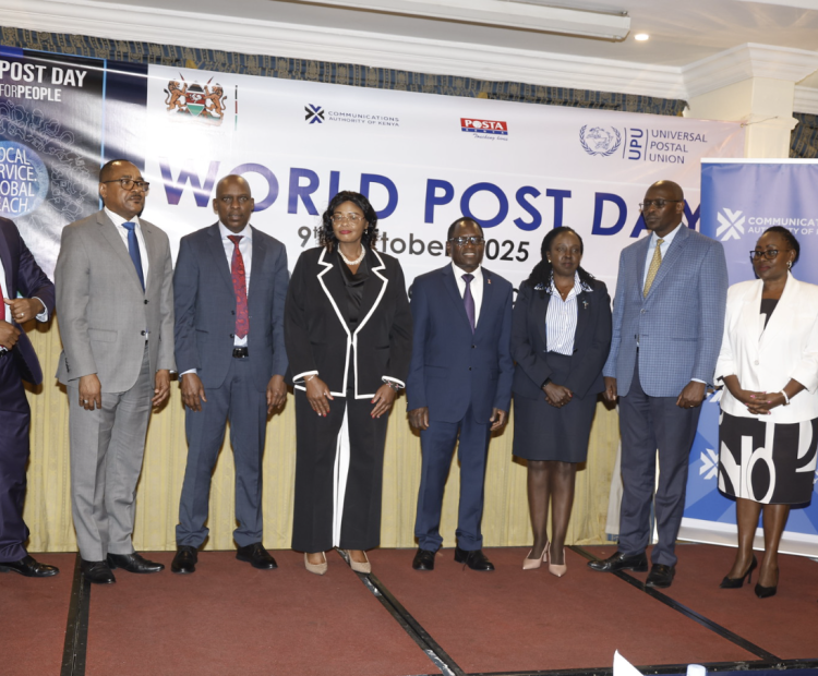 PS Stephen Isaboke poses for a group photo with CA DIrector General, David Mugonyi and Post Master General John Tanui