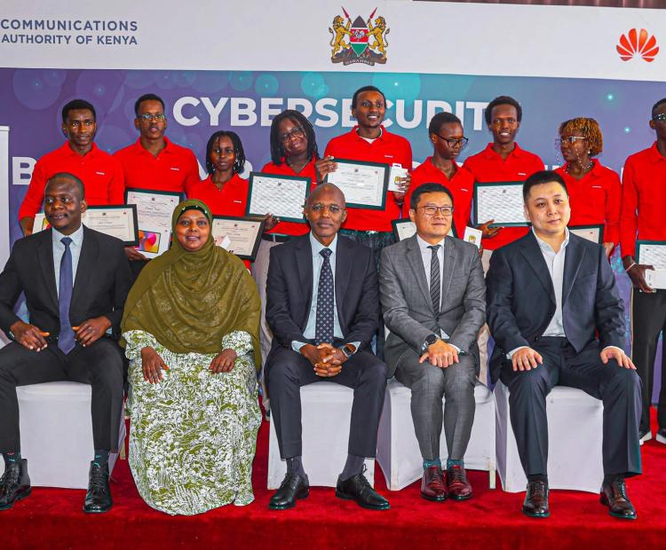 Eng. Dennis Chepkwony, Director, Universal Service Fund at the Communications Authority of Kenya poses for a group photo with reps from Huawei Kenya and winners of this year's cybersecurity bootcamp